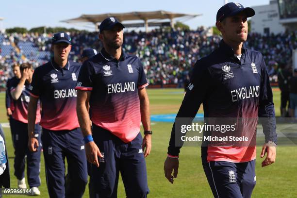 Alex Hales Liam Plunkett and Jake Ball of England walk from the field after their 8 wickets defeat during the ICC Champions Trophy Semi-Final match...