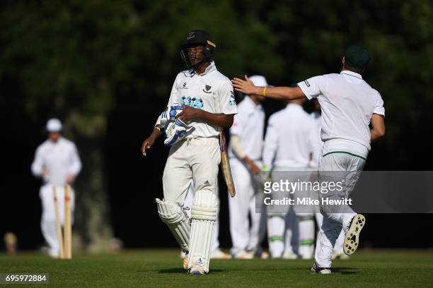 Delray Rawlins of Sussex is consoled by a South African fielder after being bowled for 96 during a Tour Match between Sussex and South Africa A at...