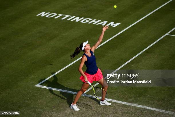 Johanna Konta of Great Britain serves partnering Yanina Wickmayer of Belgium during their Women's doubles first round match against Chia-Jung Chuang...