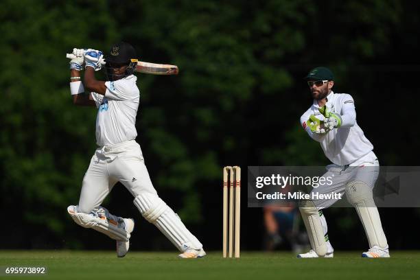 Delray Rawlins of Sussex hits out as wicketkeeper Rudi Second of South Africa A looks on during a Tour Match between Sussex and South Africa A at...