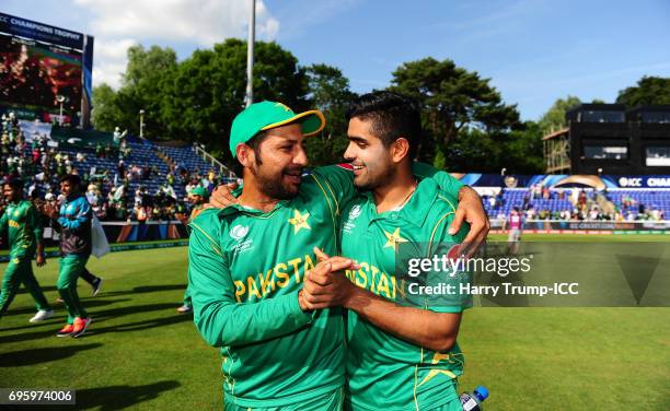 Sarfraz Ahmed, Captain of Pakistan celebrates victory with Babar Azam of Pakistan during the ICC Champions Trophy Semi Final match between England...