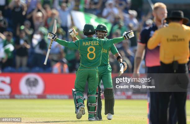 Babar Azam and Mohammad Hafeez of Pakistan embrace after winning the ICC Champions Trophy match between England and Pakistan at Swalec stadium on...