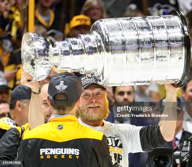 Trainer Chris Stewart of the Pittsburgh Penguins celebrates with the Stanley Cup trophy after defeating the Nashville Predators 2-0 in Game Six of...