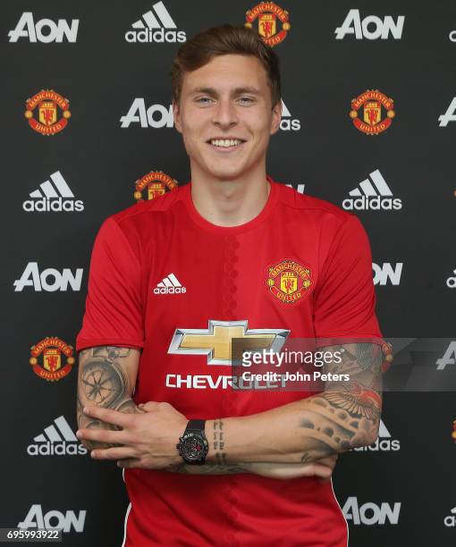 Victor Lindelof of Manchester United poses after signing for the club at Aon Training Complex on June 14, 2017 in Manchester, England.
