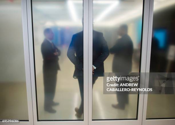 People wait for the arrival of US Federal Reserve Chair Janet Yellen for a press conference after the Federal Open Market Committee meeting in...