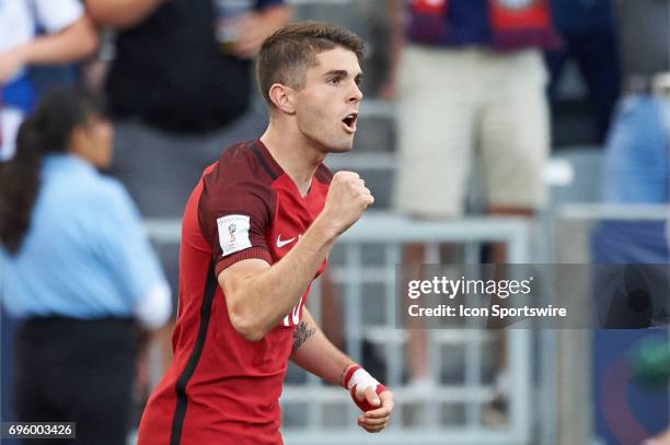 United States midfielder Christian Pulisic celebrates with fans and teammates after scoring a goal during the FIFA 2018 World Cup Qualifier match...