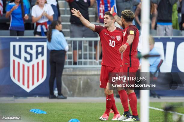 United States midfielder Christian Pulisic celebrates with fans and teammates after scoring a goal during the FIFA 2018 World Cup Qualifier match...