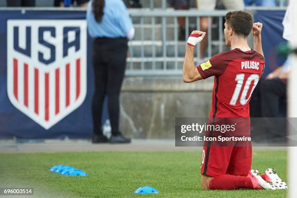 United States midfielder Christian Pulisic celebrates with fans and teammates after scoring a goal during the FIFA 2018 World Cup Qualifier match...