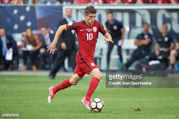 United States midfielder Christian Pulisic dribbles the ball during the FIFA 2018 World Cup Qualifier match between the United States and Trinidad &...