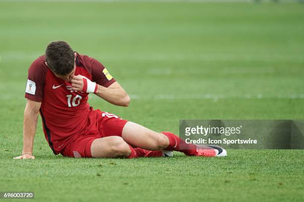 United States midfielder Christian Pulisic picks himself up after a tackle during the FIFA 2018 World Cup Qualifier match between the United States...