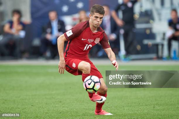 United States midfielder Christian Pulisic dribbles the ball during the FIFA 2018 World Cup Qualifier match between the United States and Trinidad &...