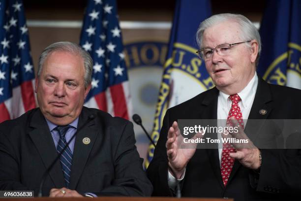 Rep. Joe Barton, R- Texas, right, coach of Republican baseball team and Rep. Mike Doyle, D-Pa., coach of the Democrats' team, conduct a news...