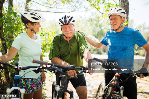 friends on bikes - friends cycling stock pictures, royalty-free photos & images