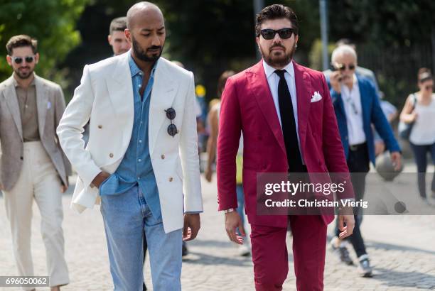 Guests wearing suit is seen during Pitti Immagine Uomo 92. At Fortezza Da Basso on June 14, 2017 in Florence, Italy.