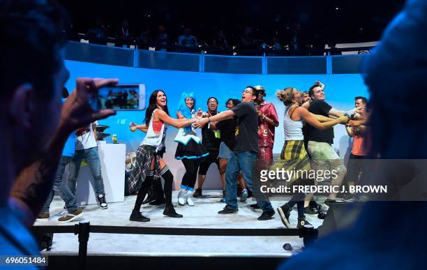 Cell phone is used to record a performance by dancers promoting Ubisoft's "Just Dance 2018" on day two of E3 2017, the three day Electronic...