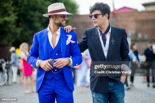 Gustes wearing navy and blue suit, denim jeans is seen during Pitti Immagine Uomo 92. At Fortezza Da Basso on June 14, 2017 in Florence, Italy.