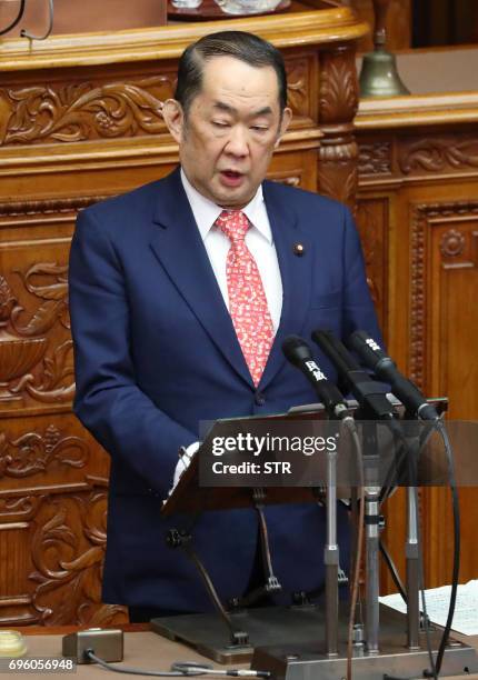 Justice Minister Katsutoshi Kaneda speaks while attending the upper house of parliament in Tokyo on June 15, 2017. The upper house of parliament...