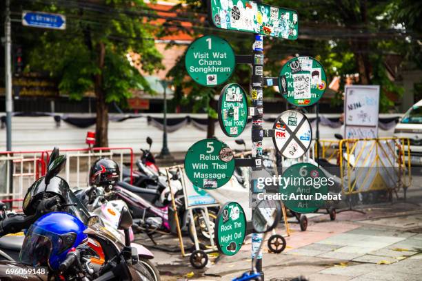 khao san road intersection, a famous place of bangkok city with road sign in a intersection. - khao san road stock pictures, royalty-free photos & images