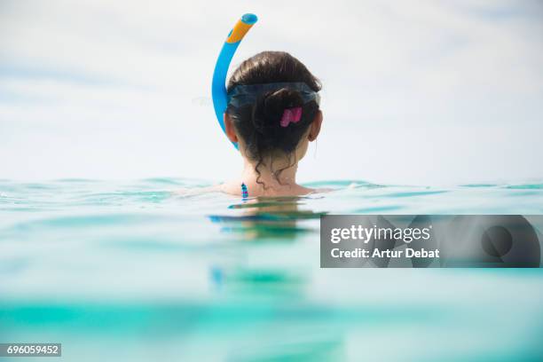 traveler girl doing snorkel in the gili islands a paradise in the indonesia during travel vacations in the islands. - swimming tube stockfoto's en -beelden