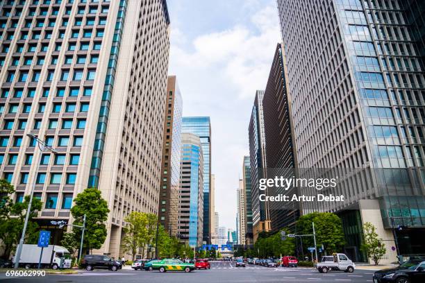 beautiful tokyo city view with tall skyscrapers and straight street taken during travel vacations in japan. - chiyoda stockfoto's en -beelden