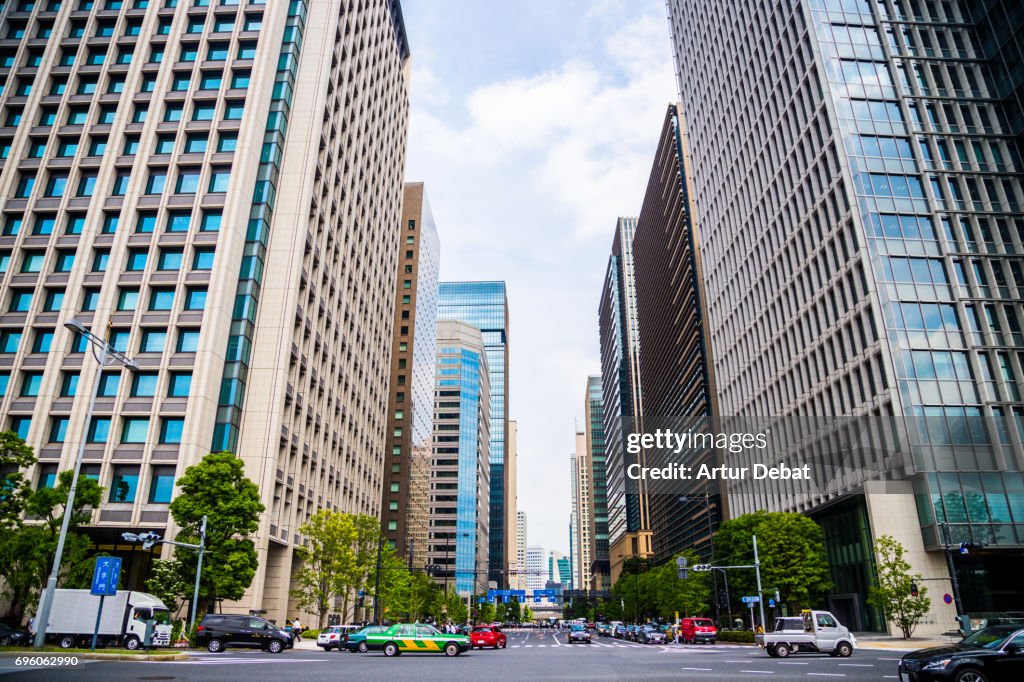 Beautiful Tokyo city view with tall skyscrapers and straight street taken during travel vacations in Japan.