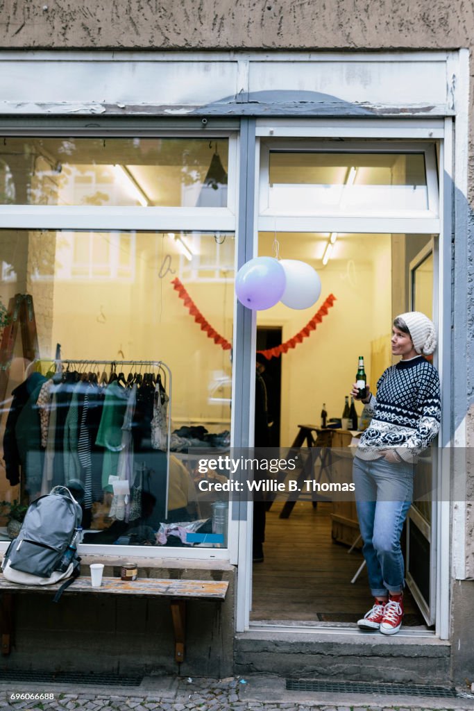 Woman Standing In Doorway Of Newly Opened Vintage Store