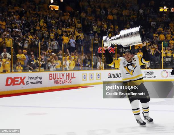 Sidney Crosby of the Pittsburgh Penguins celebrates with the Stanley Cup following a victory over the Nashville Predators in Game Six of the 2017 NHL...