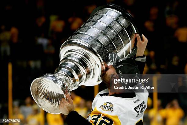 Mark Streit of the Pittsburgh Penguins celebrates with the Stanley Cup Trophy after they defeated the Nashville Predators 2-0 to win the 2017 NHL...