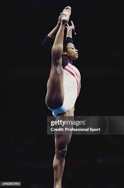 American artistic gymnast Dominique Dawes pictured in action competing for United States in the floor exercise during competition in the Women's...