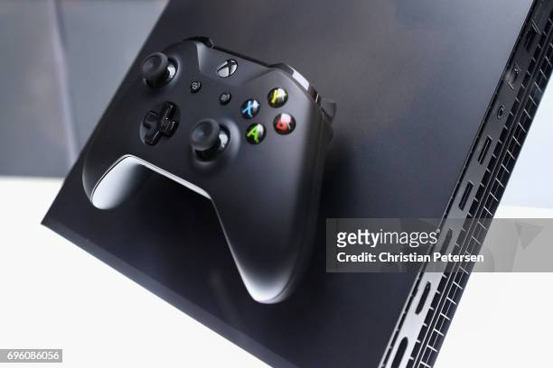 The upcoming 'XBox One X' is displayed during the Electronic Entertainment Expo E3 at the Los Angeles Convention Center on June 13, 2017 in Los...