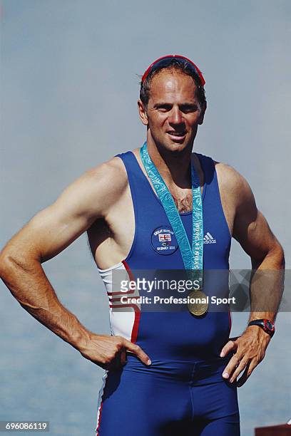 English rower Steve Redgrave pictured wearing his fifth gold medal on the podium after the Great Britain team finished in first place to win the gold...