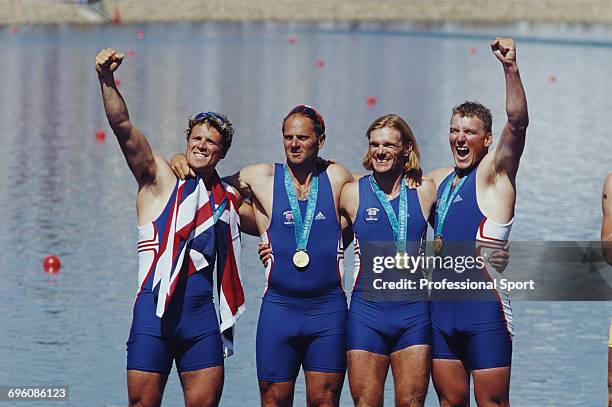 English rowers, from left, James Cracknell, Steve Redgrave, Tim Foster and Matthew Pinsent pictured together celebrating with their gold medals on...