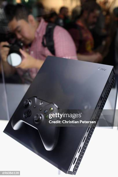 The upcoming 'XBox One X' is displayed during the Electronic Entertainment Expo E3 at the Los Angeles Convention Center on June 13, 2017 in Los...