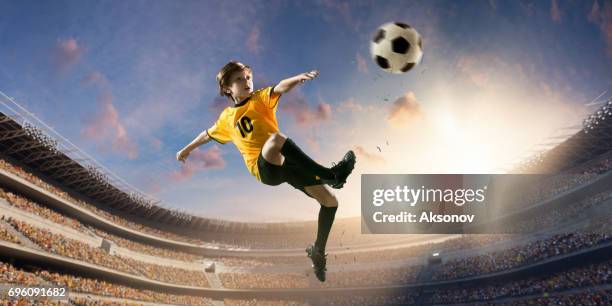soccer kids player in action in 3d dramatic stadium - athletics stadium stock pictures, royalty-free photos & images