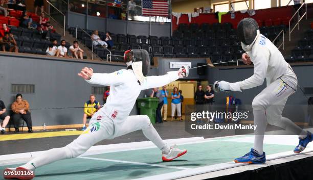 Alexandre Camargo of Brazil lunges in an attach against John Edison Rodriguez of Colombia during semi-final action in the Men's Epee event on June...