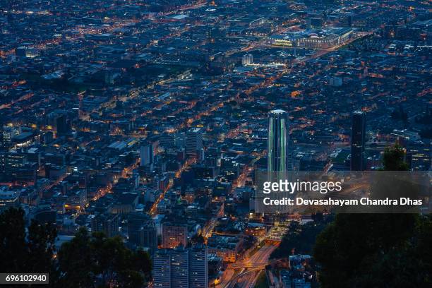 bogota, colombia - view of downtown from monserrate after sunset; street lights and light trails - monserrate bogota stock pictures, royalty-free photos & images