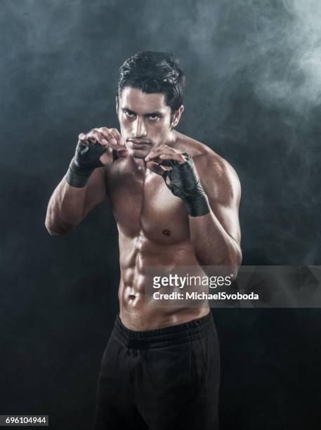 boxer shadow boxing warm up - mixed martial arts stock pictures, royalty-free photos & images