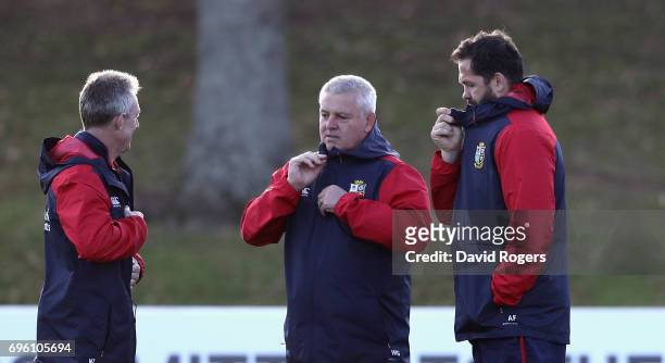 Warren Gatland the Lions head coach talks to his assistant coaches Rob Howley and Andy Farrell during the British & Irish Lions training session held...