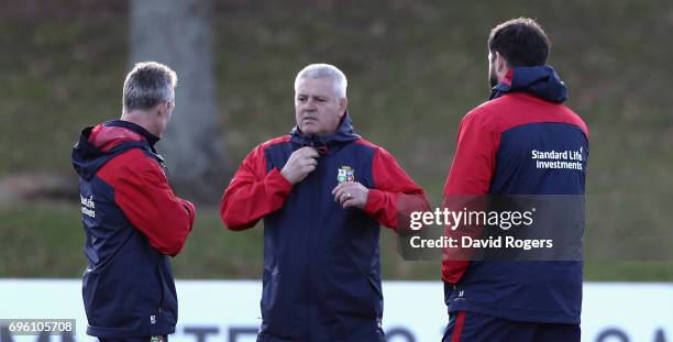 Warren Gatland the Lions head coach talks to his assistant coaches Rob Howley and Andy Farrell during the British & Irish Lions training session held...