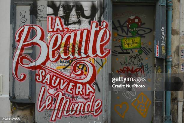 Graffiti 'The Beauty Will Save The World' seen in Montmartre quarter. On Friday, June 14 in Paris, France.