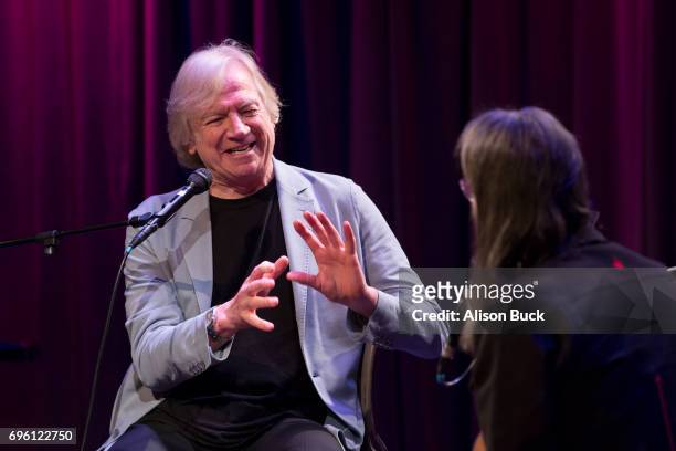 Musician Justin Hayward and Vice President of The GRAMMY Foundation and MusiCares Scott Goldman speak onstage during An Evening With Justin Hayward...