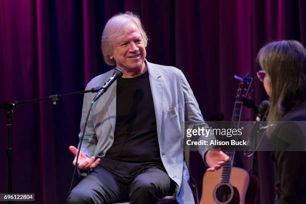 Musician Justin Hayward and Vice President of The GRAMMY Foundation and MusiCares Scott Goldman speak onstage during An Evening With Justin Hayward...