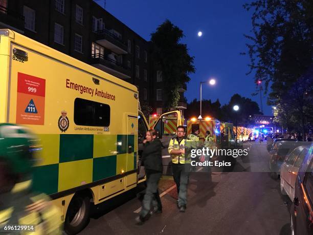 Emergency services respond to a huge fire that engulfed the 24 story Grenfell Tower in Latimer Road, West London as emergency services attended in...