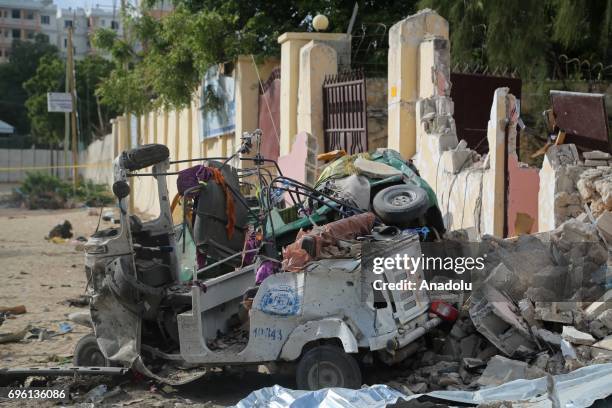 Wreckage of a car is seen at the site after bomb-laden vehicle attack by Al-Shabaab militants to a restaurant in Mogadishu, Somalia on June 15, 2017....