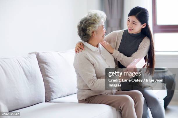 happy mother and daughter with gift box - mothers day gift daughter stock pictures, royalty-free photos & images