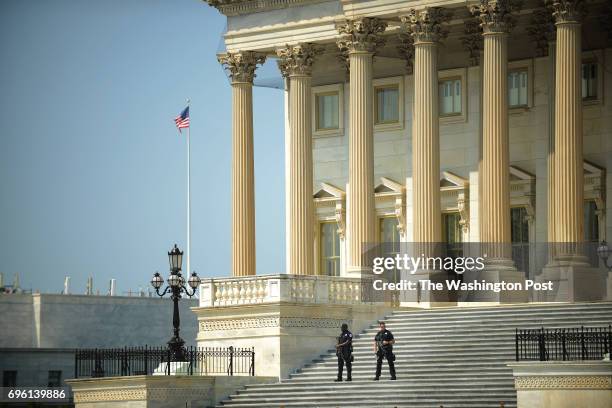 Capitol police are armed with machine guns while guarding the U.S. Capitol in Washington, D.C., June 14 after House Majority Whip Steve Scalise and...