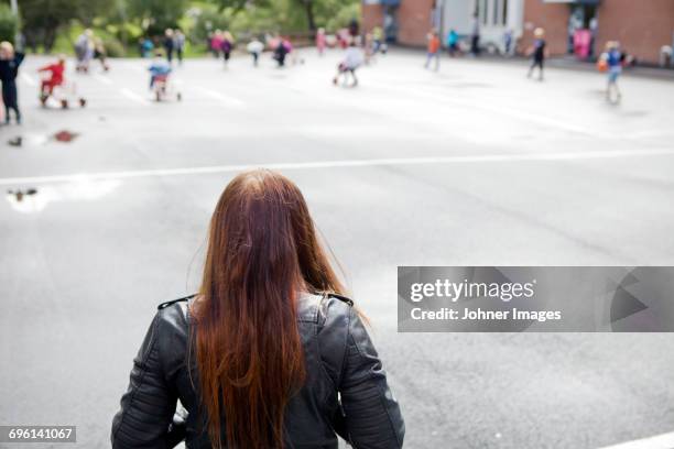 alone girl on the school yard - pest stockfoto's en -beelden