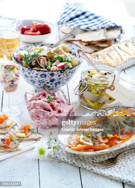 various food on table - arenque fotografías e imágenes de stock