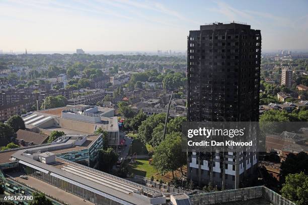Grenfall tower continues to smoulder on June 15, 2017 in London, England. At least twelve people have been confirmed dead and dozens missing after...