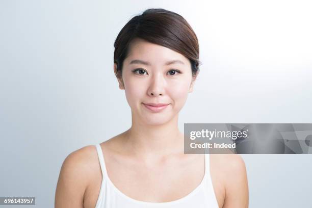 portrait of young woman, wearing camisole - cami stockfoto's en -beelden